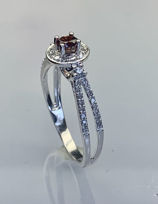 10k White Gold Diamond Split Shank Ring With Round Red Garnet